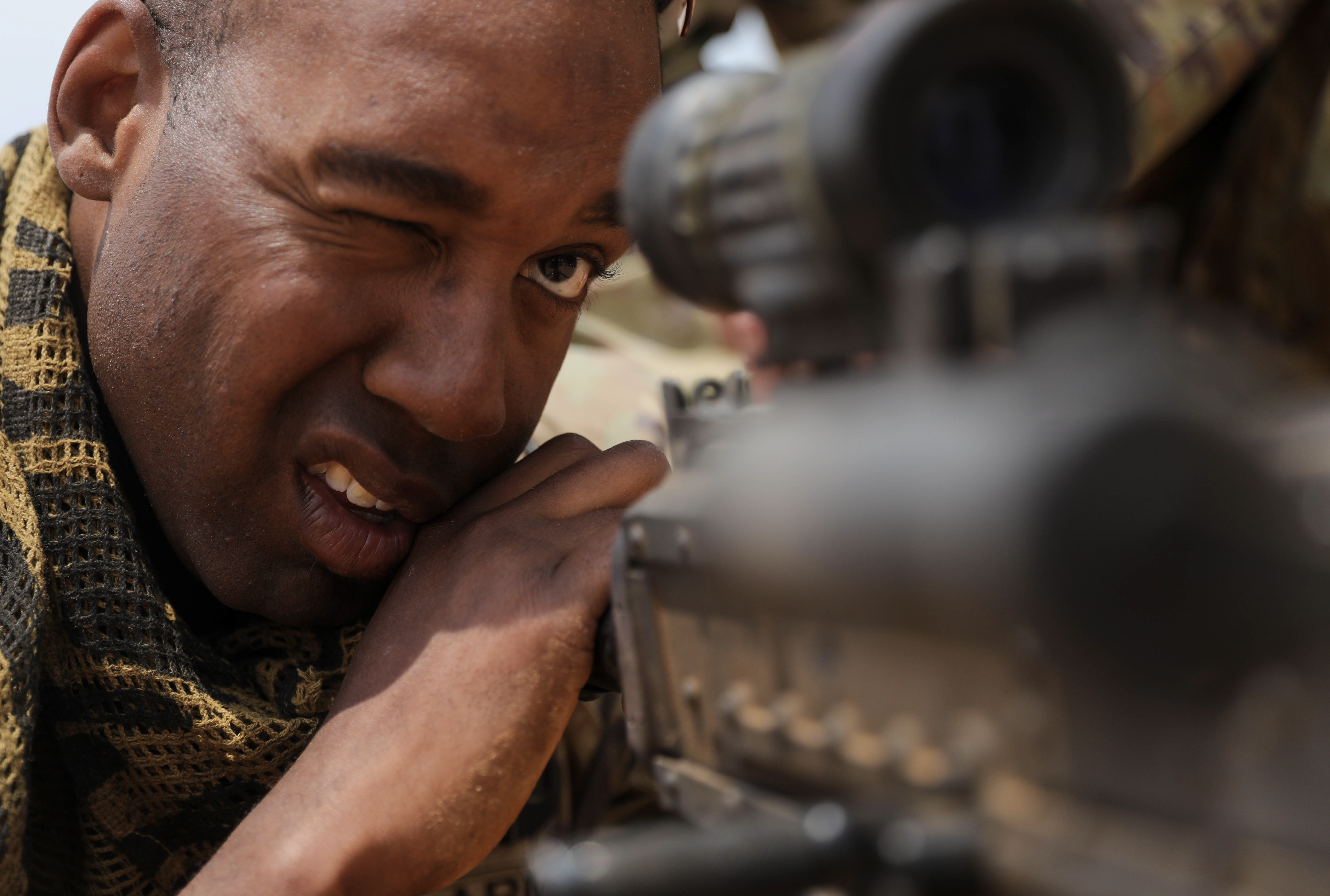 Army Corporal Aaron Hough aims M240B machine gun during exercise African Lion 25, largest U.S.-led military exercise on African continent, at Cap Draa, Tan-Tan, Morocco, May 16, 2025 (U.S. Army/Blake A. Essex)